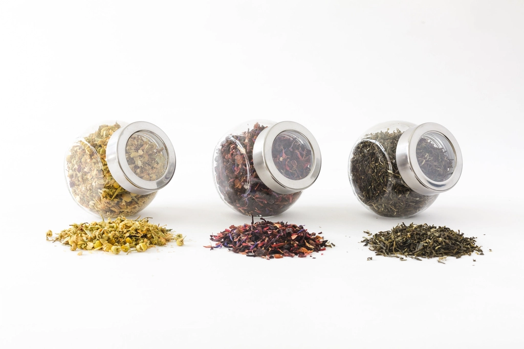 Glass jars of dried herbs